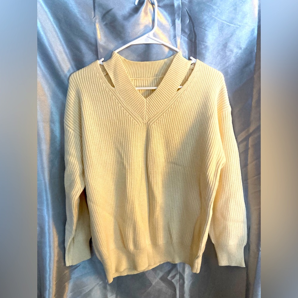 Knit pullover with neckline detail. Size small, cream colored, brand unknown.